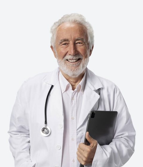 A cheerful senior doctor holding a tablet and wearing a stethoscope