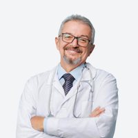 A smiling senior doctor in a white coat with a stethoscope